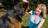 photo of a woman talking with her dog